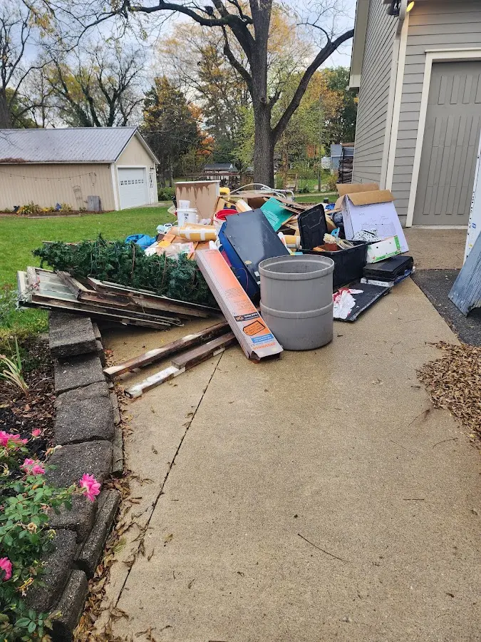 Dumpster being loaded with debris for 30 Yard Dumpster Rental in Arden Hills